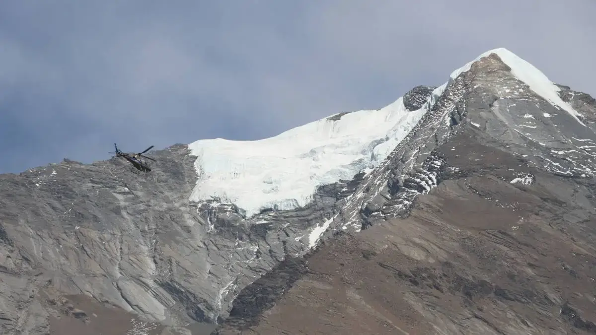 Helicopter flying over Annapurna mountains